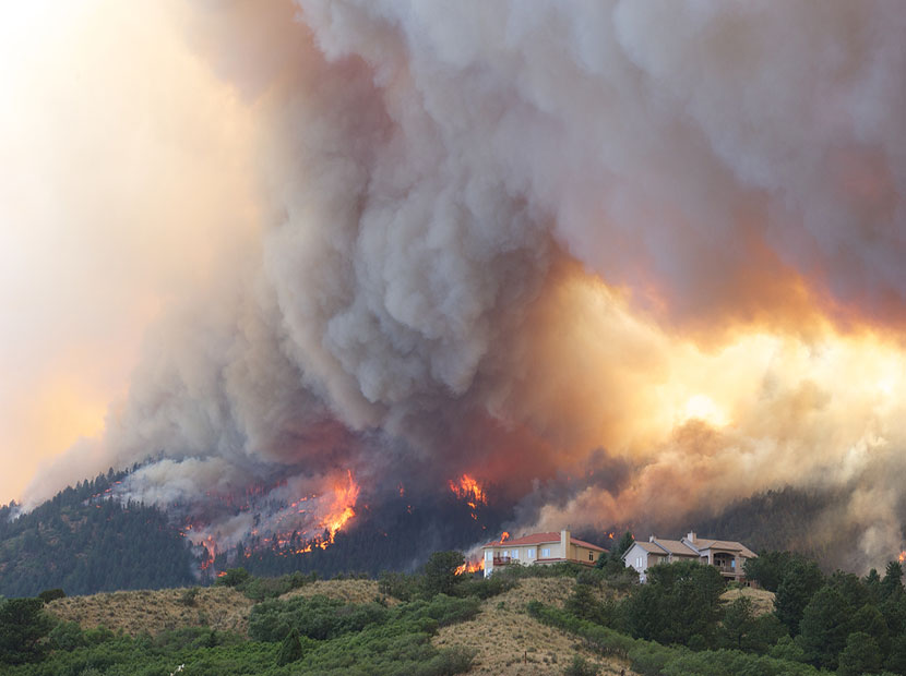 Houses surrounded by wildfire