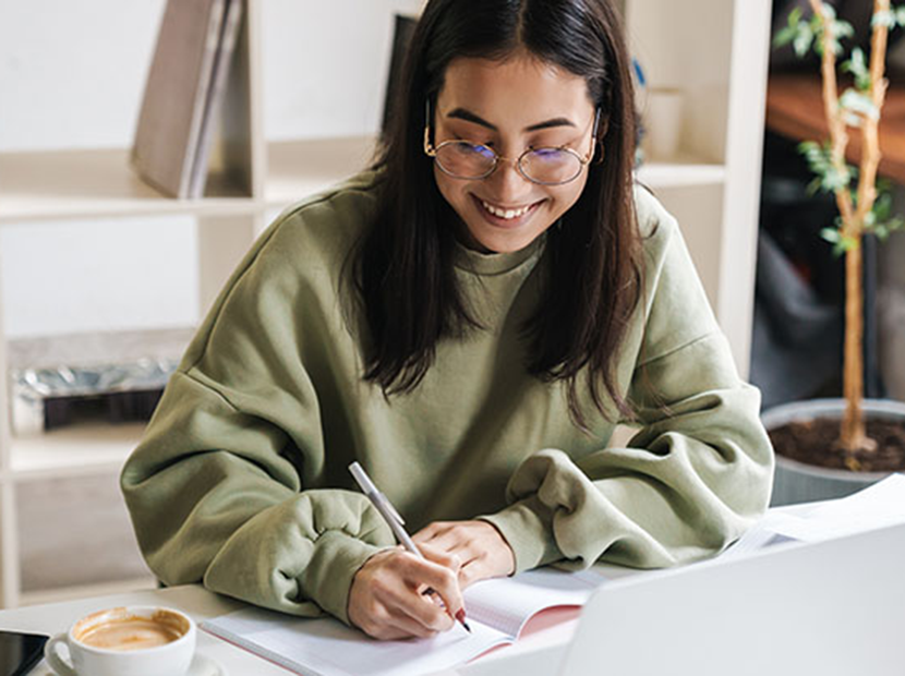 Person writing in a notebook