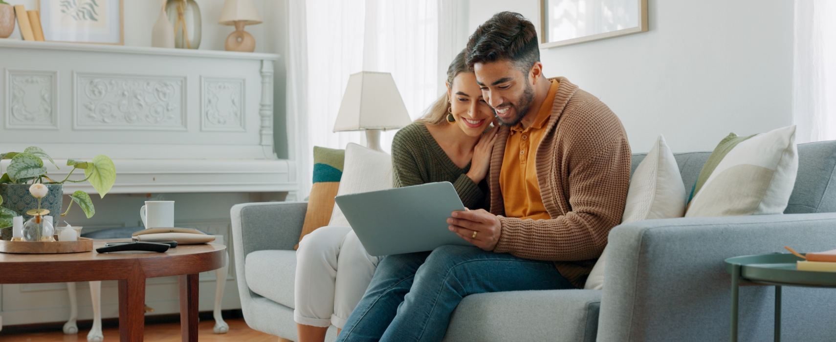 Man and woman looking at laptop