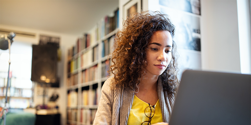 Person sitting in front of laptop
