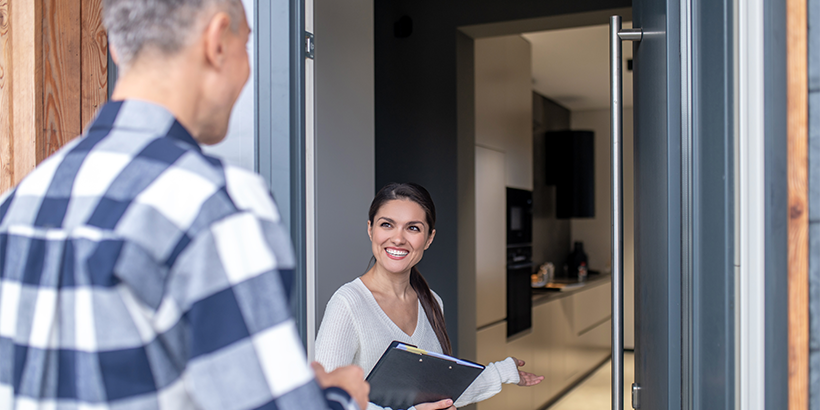 Real estate professional holding a clipboard