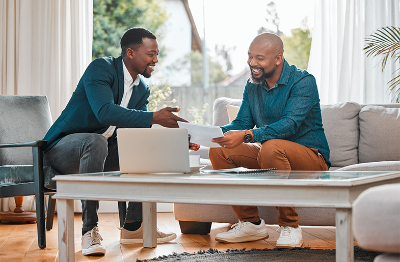 Two people sitting in front of a computer