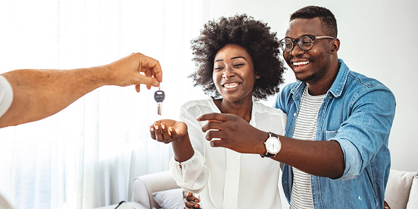 New homeowners receiving keys