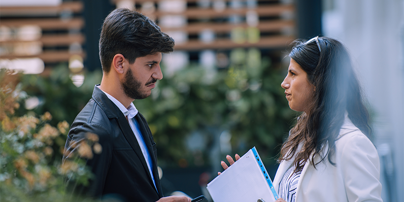 Homebuyer and real estate agent discussing a counteroffer