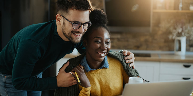 Homebuyers doing research on a laptop computer