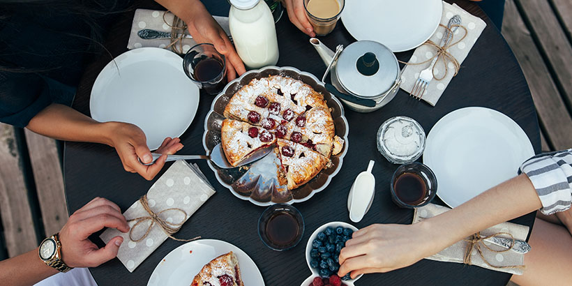 Friends sharing a pie