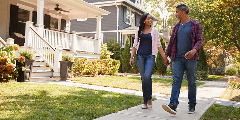 Couple walking in neighborhood