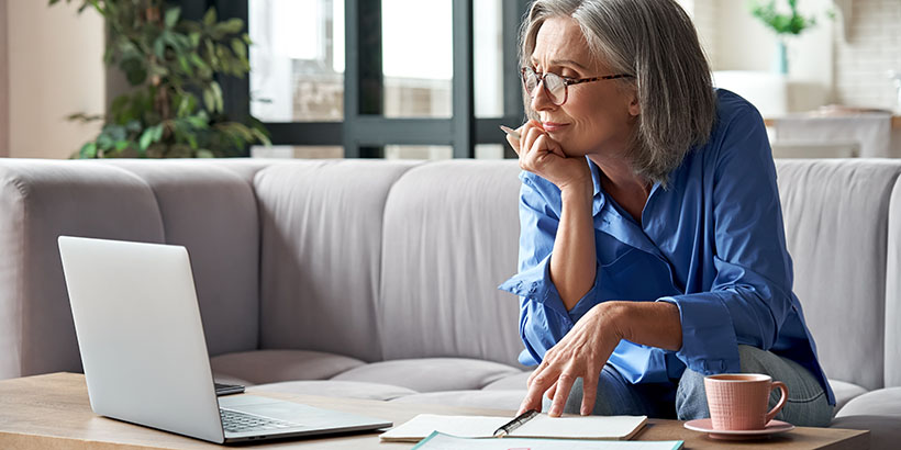 Homeowner contemplating something on a computer screen