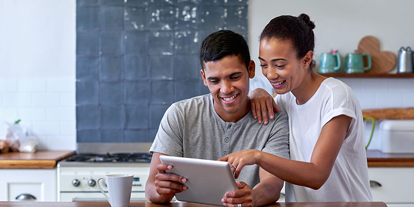 Couple looking at tablet