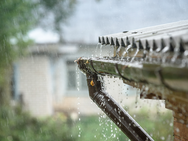Rain collecting in a home's gutter
