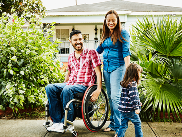 A family in front of their home