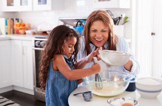 Grandmother baking with grandchild