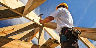 Construction worker framing house