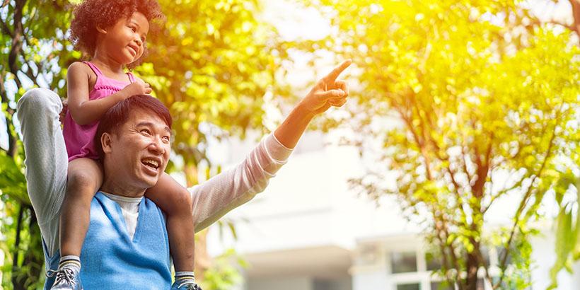 Father with child on his shoulders