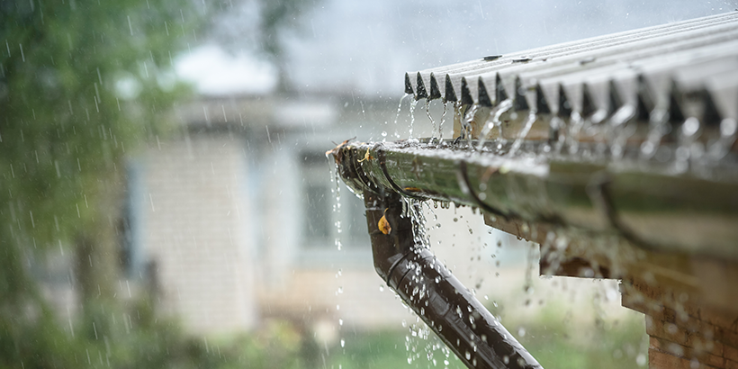 Rain collecting in a home's gutter