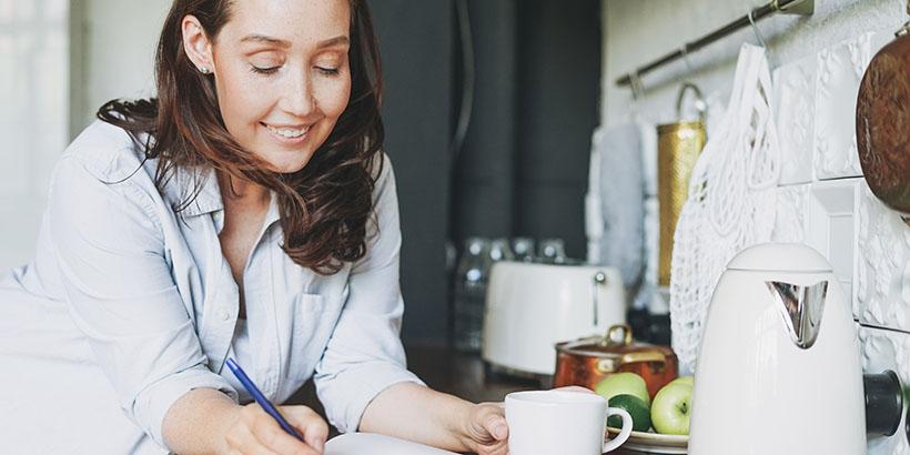 woman writing in journal