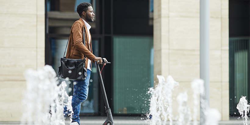 Man riding an electric scooter