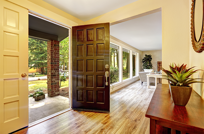 Foyer of a home with an open front door