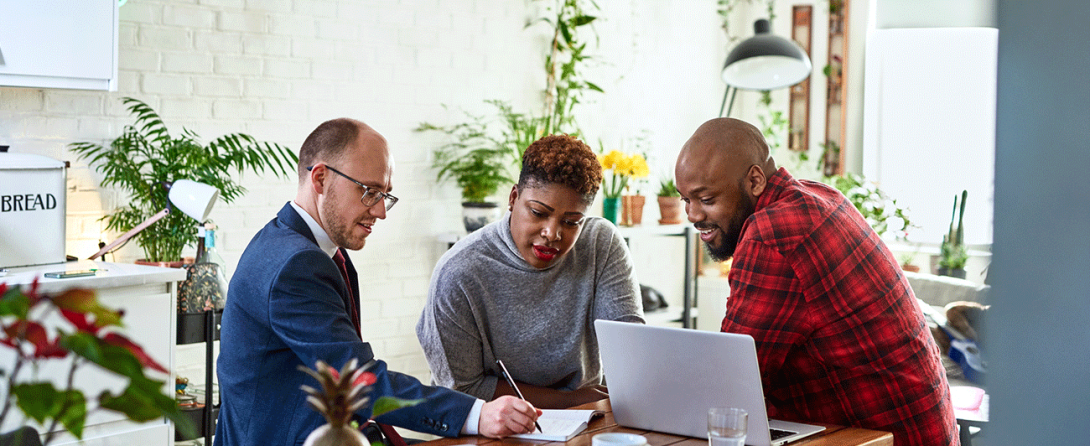 Homeowners talking to a mortgage professional about refinancing