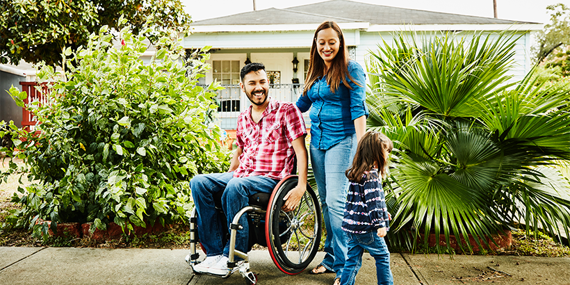 A family in front of their home