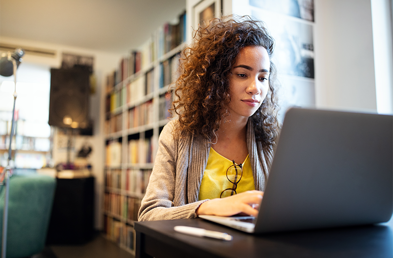 Person sitting in front of laptop