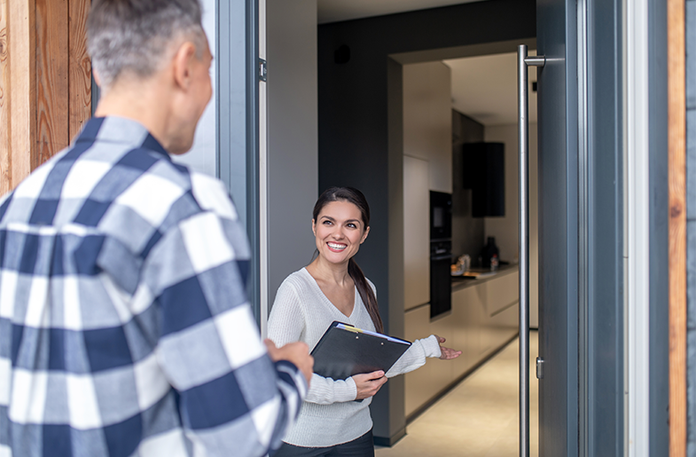 Real estate professional holding a clipboard