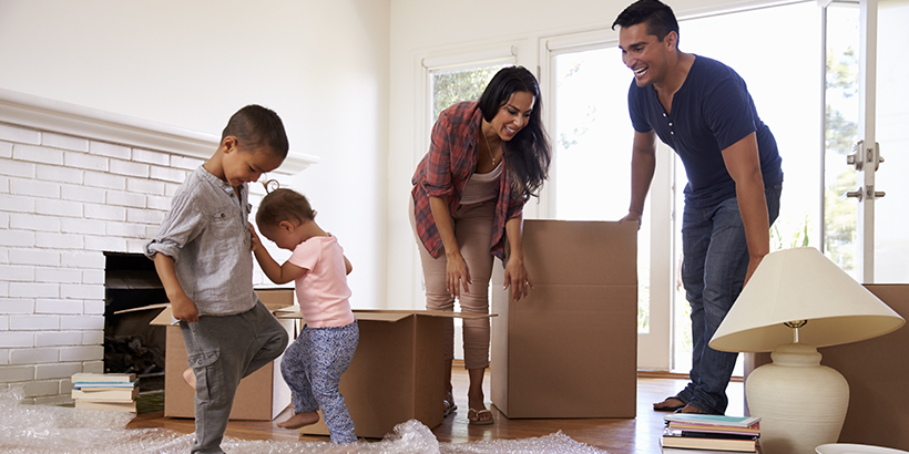 Family with moving boxes