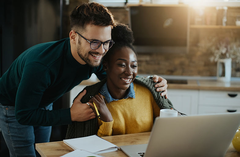Homebuyers doing research on a laptop computer