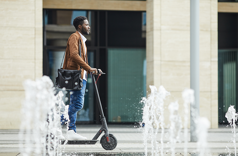 Man riding an electric scooter