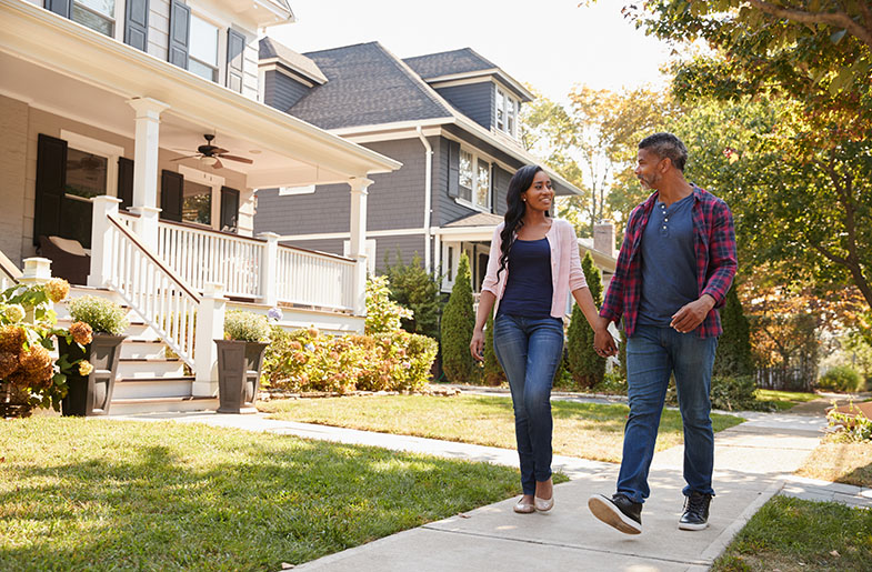 Couple walking in neighborhood