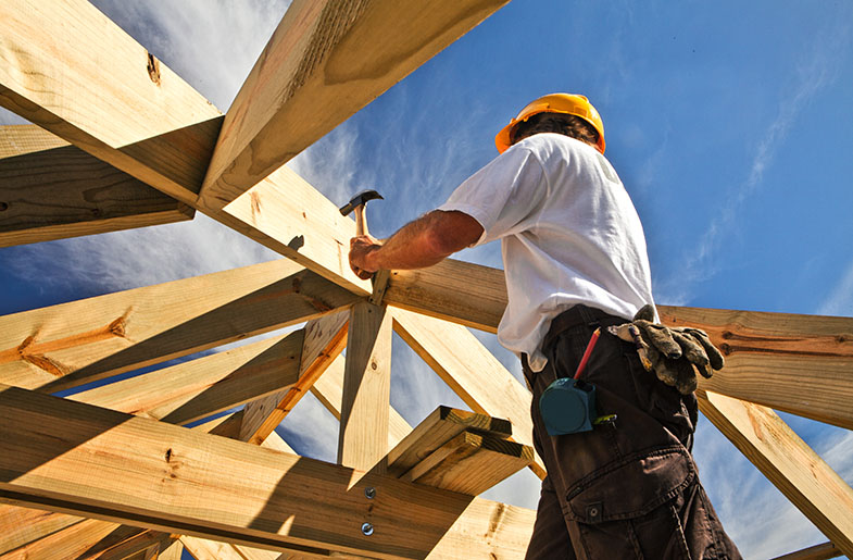 Construction worker framing house