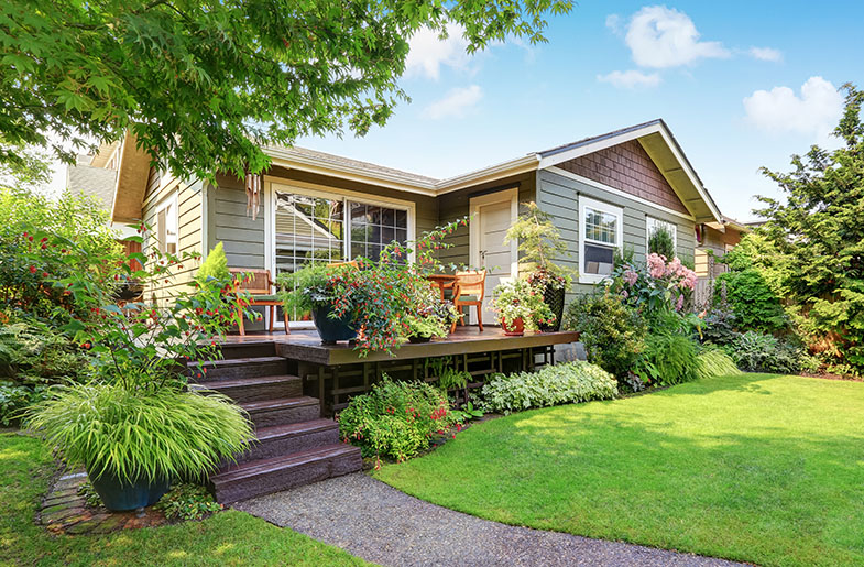 Single-family home with porch and garden