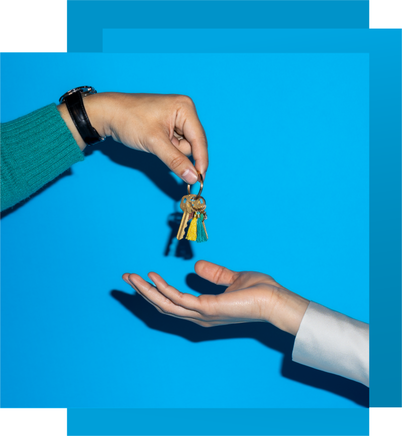 Keys being passed from one hand to another person's hand