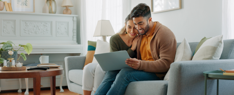 Man and woman looking at laptop