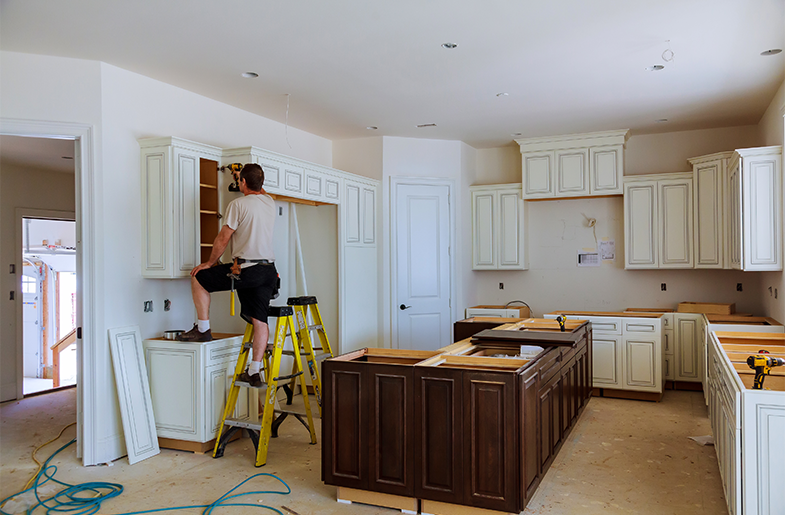 Person working on a kitchen remodel