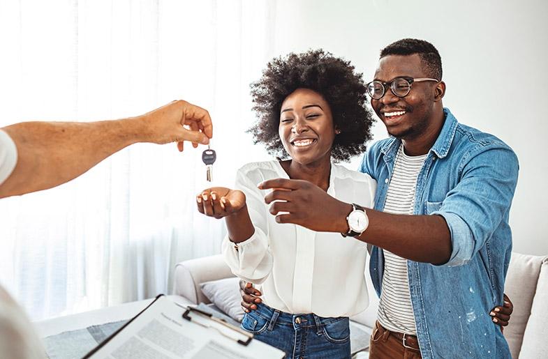 New homeowners receiving keys