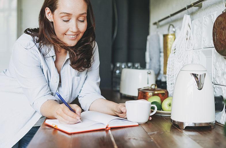 woman writing in journal