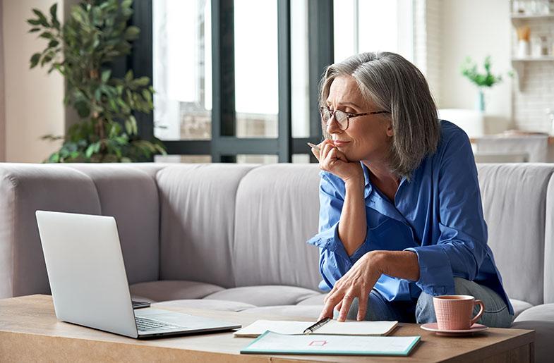 Homeowner contemplating something on a computer screen